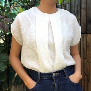 Pleated front textured short sleeve blouse